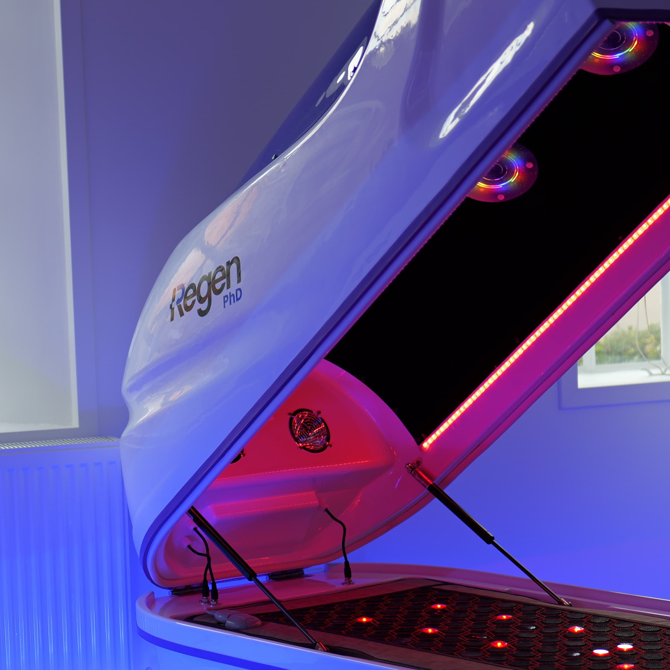 Close-up of an open Regen Pod canopy with light arrays and the Regen PhD mark
